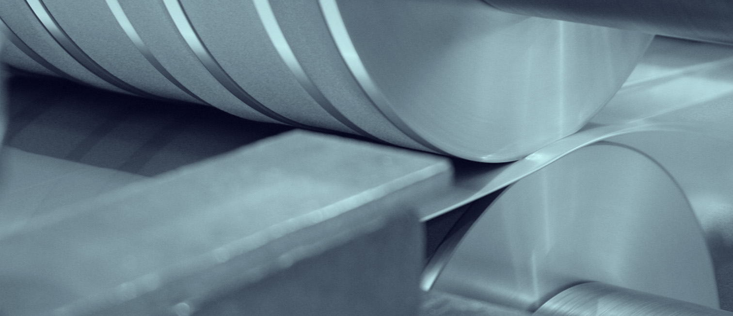 Precision stainless steel strip being slit into narrow coils